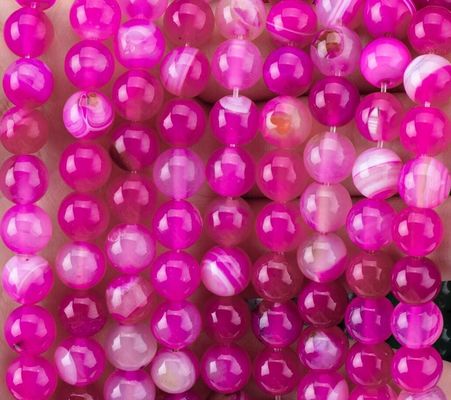 Flusso di perline di agata a strisce di fuchsia naturale per la fabbricazione di gioielli