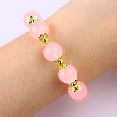 Braccialetto di perline rosa di quarzo da 12 mm con incantesimo di cervo