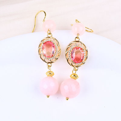 Multicristallo naturale rosa di quarzo con forma rotonda con orecchini di forma ovale rosa